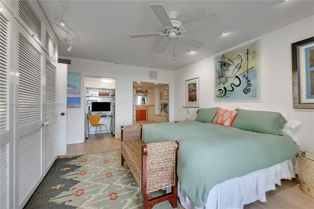 200 Ocean Lane Dr Unit 305, Key Biscayne, FL 33149 - bedroom with wood finished floors, a ceiling fan, a closet, and ensuite bathroom