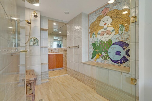 200 Ocean Lane Dr Unit 305, Key Biscayne, FL 33149 - bathroom featuring tile walls, vanity, and tiled shower