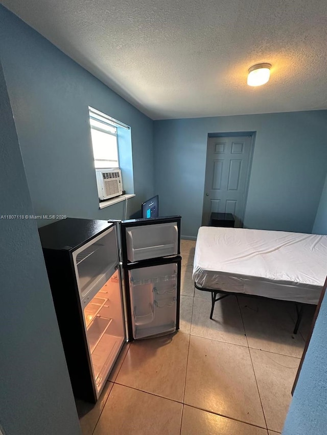 131 Carolina Ave, Fort Lauderdale, FL 33312 - bedroom with a textured ceiling, cooling unit, and light tile patterned floors