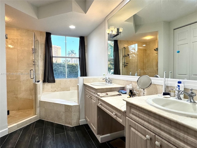 826 E Spinnaker Dr E, Hollywood, FL 33019 - bathroom featuring a garden tub, a stall shower, double vanity, wood finished floors, and recessed lighting