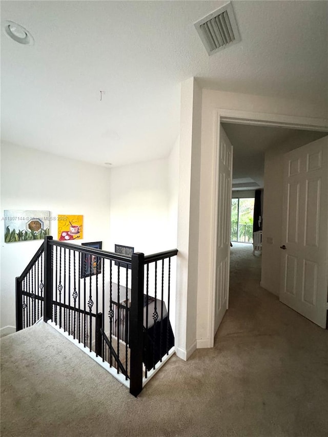 826 E Spinnaker Dr E, Hollywood, FL 33019 - hall with an upstairs landing, carpet, and baseboards