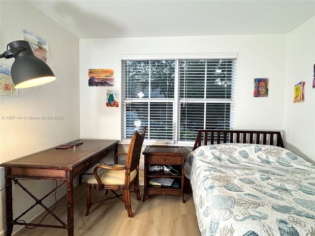 826 E Spinnaker Dr E, Hollywood, FL 33019 - bedroom with wood finished floors and a desk