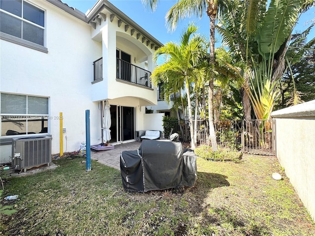 826 E Spinnaker Dr E, Hollywood, FL 33019 - back of property featuring central air condition unit, a balcony, and stucco siding