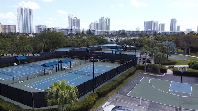 826 E Spinnaker Dr E, Hollywood, FL 33019 - view of tennis court with a skyline view