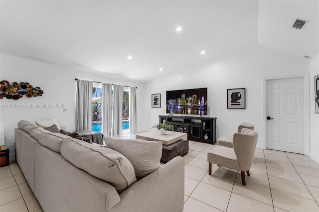 10020 SW 145th Pl, Miami, FL 33186 - living area featuring light tile patterned flooring, lofted ceiling, and recessed lighting