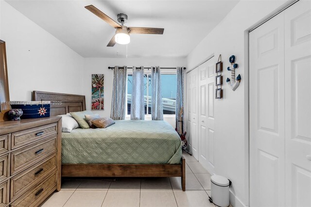 10020 SW 145th Pl, Miami, FL 33186 - bedroom with light tile patterned floors and a ceiling fan