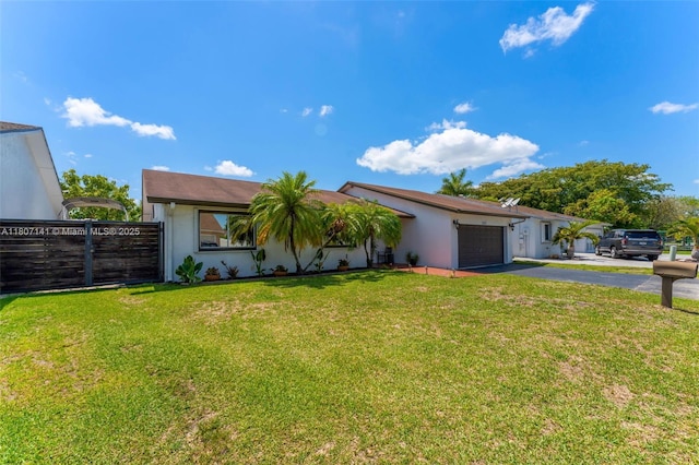 10020 SW 145th Pl, Miami, FL 33186 - view of front of house with asphalt driveway, stucco siding, and an attached garage