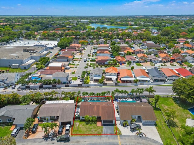 10020 SW 145th Pl, Miami, FL 33186 - aerial perspective of suburban area with property boundaries highlighted and a nearby body of water