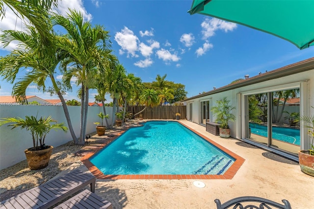 10020 SW 145th Pl, Miami, FL 33186 - view of pool featuring a fenced backyard and a patio
