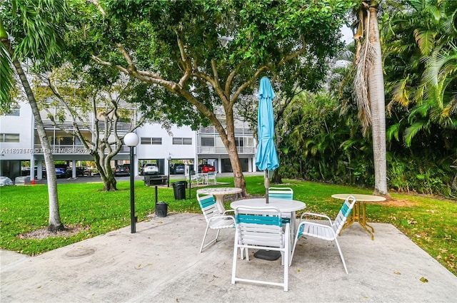 1425 Atlantic Shores Blvd Unit 204, Hallandale Beach, FL 33009 - view of patio with outdoor dining space