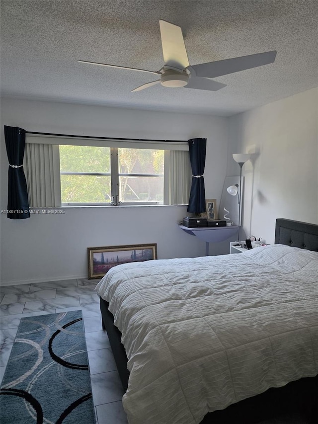 1425 Atlantic Shores Blvd Unit 204, Hallandale Beach, FL 33009 - bedroom with ceiling fan, marble look tile flooring, and a textured ceiling