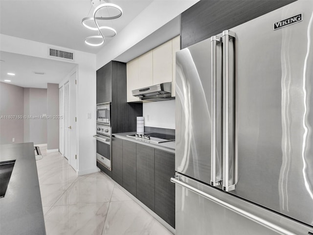 9821 E Bay Harbor Dr Unit 302, Bay Harbor Islands, FL 33154 - kitchen with appliances with stainless steel finishes, under cabinet range hood, light marble finish floors, and modern cabinets