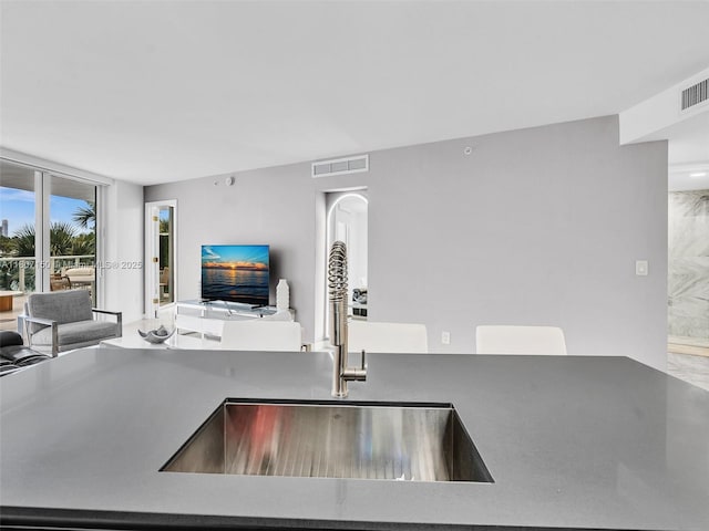 9821 E Bay Harbor Dr Unit 302, Bay Harbor Islands, FL 33154 - kitchen with open floor plan and a sink