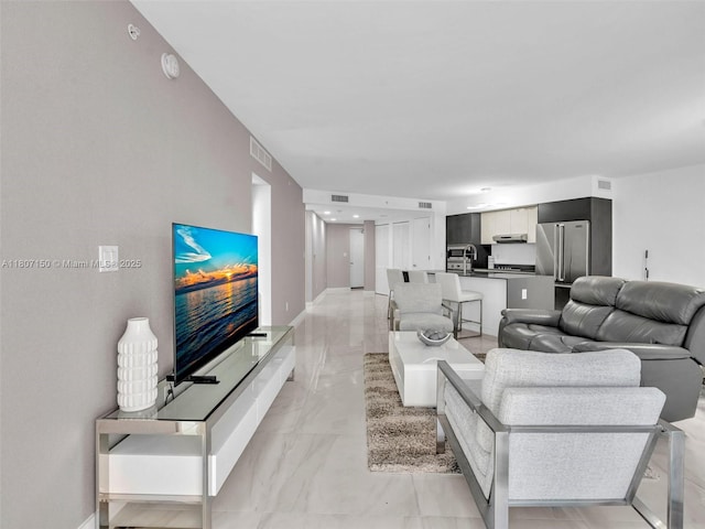 9821 E Bay Harbor Dr Unit 302, Bay Harbor Islands, FL 33154 - living room with light marble finish floors and baseboards