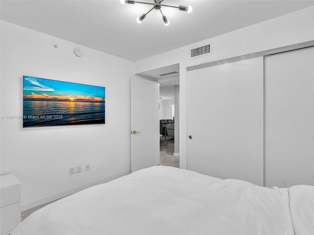 9821 E Bay Harbor Dr Unit 302, Bay Harbor Islands, FL 33154 - bedroom with a closet and baseboards