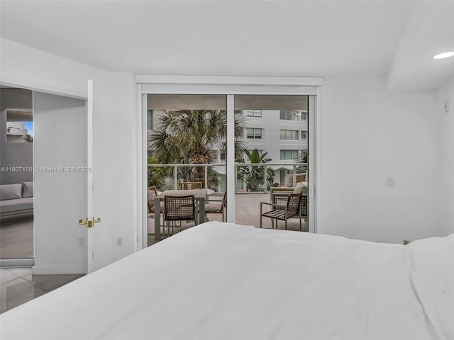 9821 E Bay Harbor Dr Unit 302, Bay Harbor Islands, FL 33154 - tiled bedroom featuring multiple windows, floor to ceiling windows, and baseboards