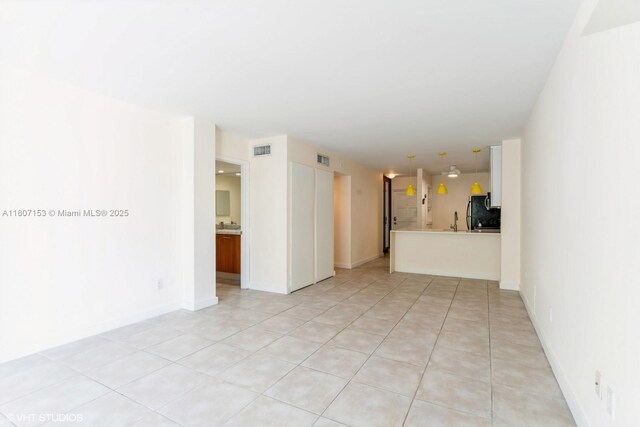 750 NE 64th St Unit B308, Miami, FL 33138 - empty room with light tile patterned floors