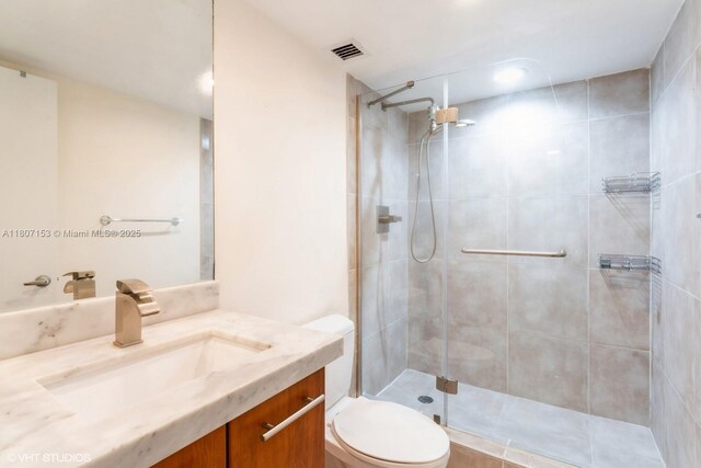 750 NE 64th St Unit B308, Miami, FL 33138 - bathroom featuring tiled shower, toilet, and vanity