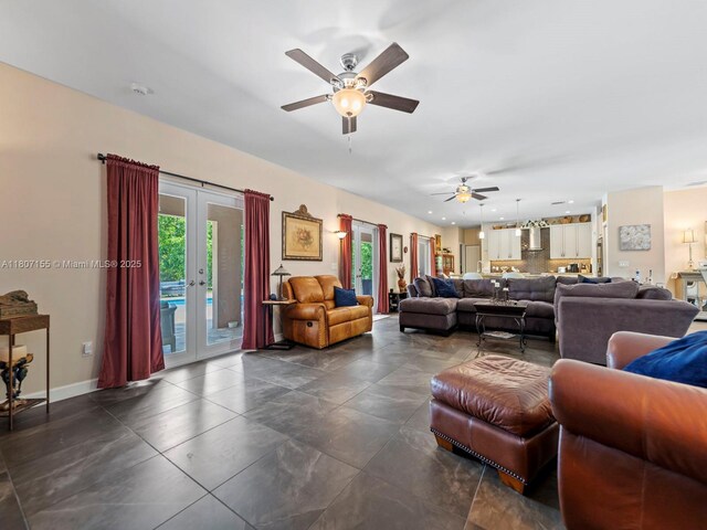 15150 SW 240th St, Homestead, FL 33032 - living area with a ceiling fan, french doors, and dark tile patterned floors