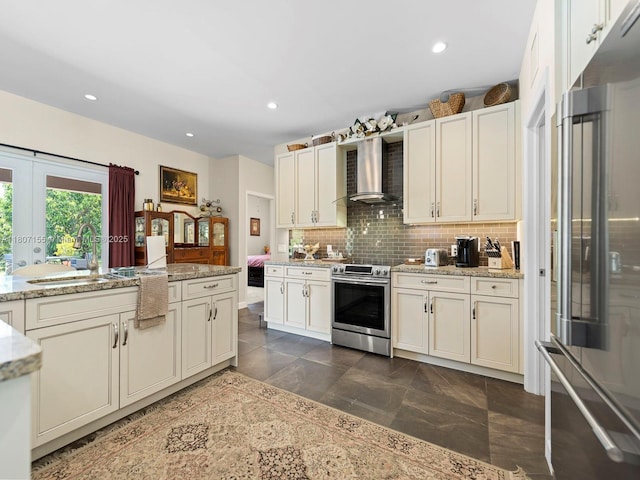 15150 SW 240th St, Homestead, FL 33032 - kitchen with stainless steel electric range oven, high quality fridge, wall chimney exhaust hood, backsplash, and a sink