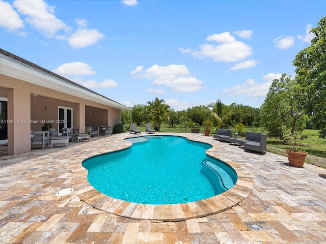 15150 SW 240th St, Homestead, FL 33032 - outdoor pool featuring a patio area, an outdoor living space, and french doors