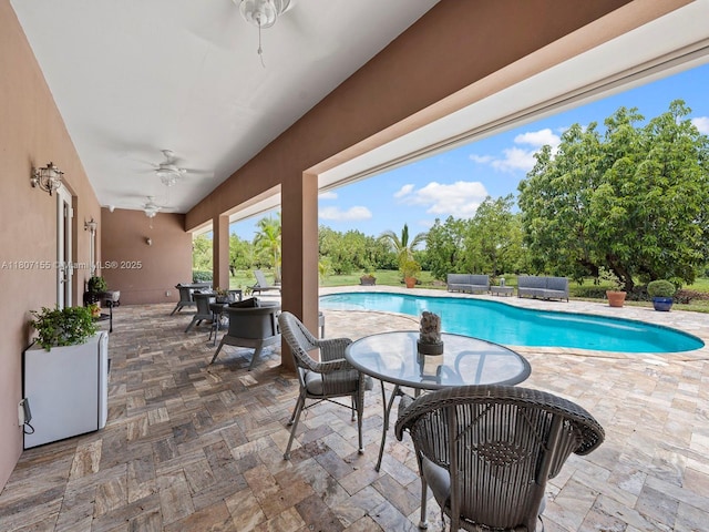 15150 SW 240th St, Homestead, FL 33032 - swimming pool with outdoor lounge area, a patio, ceiling fan, and outdoor dining area