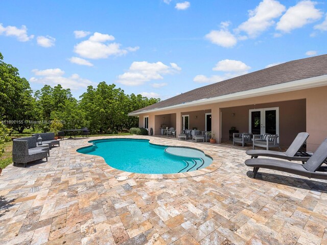 15150 SW 240th St, Homestead, FL 33032 - swimming pool with a patio area, outdoor lounge area, and french doors