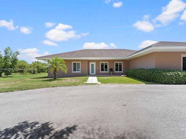 15150 SW 240th St, Homestead, FL 33032 - ranch-style home with a front lawn and stucco siding