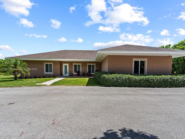 15150 SW 240th St, Homestead, FL 33032 - single story home with stucco siding and a front lawn