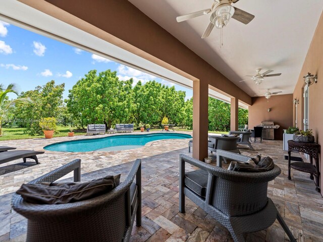 15150 SW 240th St, Homestead, FL 33032 - swimming pool featuring a ceiling fan, a patio area, and a grill