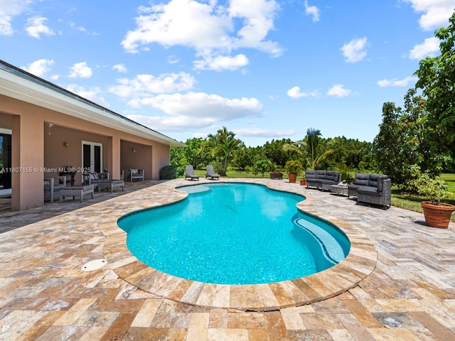 15150 SW 240th St, Homestead, FL 33032 - swimming pool featuring outdoor lounge area, a patio area, and french doors