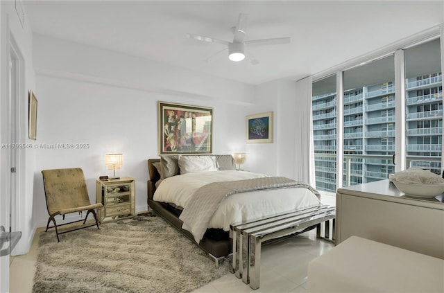475 Brickell Ave Unit 4711, Miami, FL 33131 - bedroom featuring tile patterned floors, floor to ceiling windows, and ceiling fan