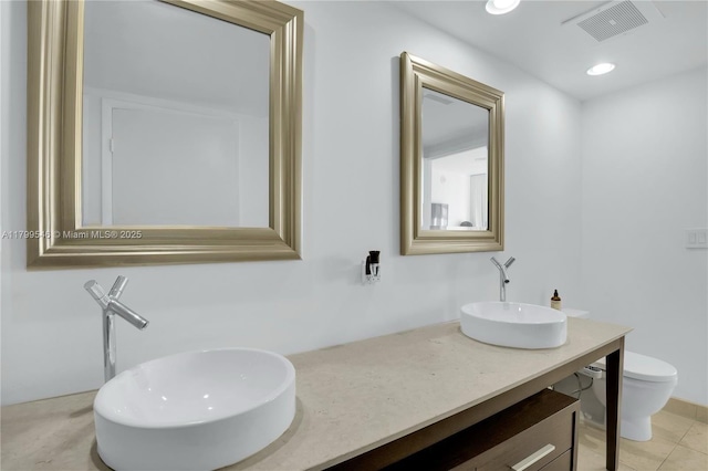 475 Brickell Ave Unit 4711, Miami, FL 33131 - bathroom with toilet, double vanity, recessed lighting, and tile patterned floors