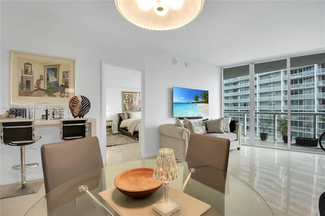 475 Brickell Ave Unit 4711, Miami, FL 33131 - tiled dining room featuring expansive windows