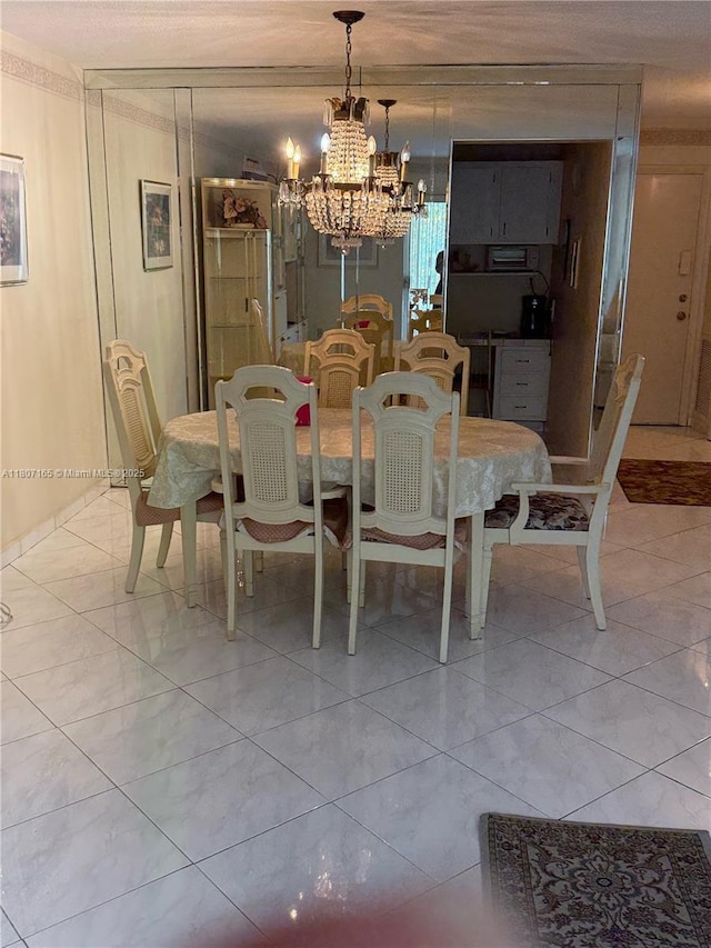 1395 NE 167th St Unit 203, Miami, FL 33162 - dining room with a chandelier and light marble finish floors