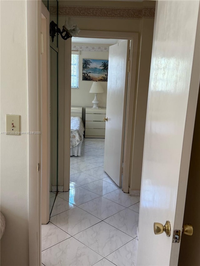 1395 NE 167th St Unit 203, Miami, FL 33162 - hall featuring light marble finish floors
