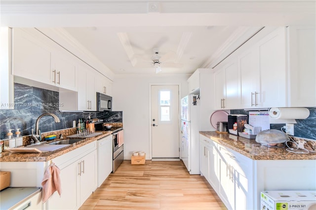2924 Day Ave Unit Ph4N, Miami, FL 33133 - kitchen featuring black microwave, stainless steel range with electric stovetop, white cabinets, light wood finished floors, and crown molding