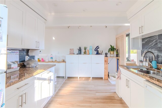 2924 Day Ave Unit Ph4N, Miami, FL 33133 - kitchen featuring white dishwasher, ornamental molding, decorative backsplash, light stone countertops, and white cabinetry