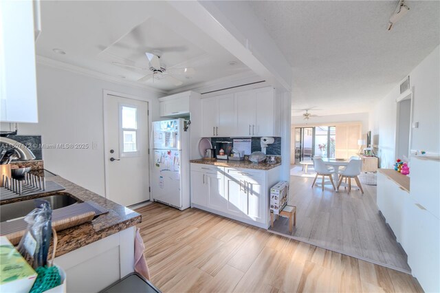 2924 Day Ave Unit Ph4N, Miami, FL 33133 - kitchen with freestanding refrigerator, ceiling fan, plenty of natural light, and white cabinets