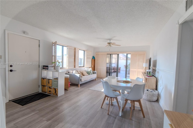 2924 Day Ave Unit Ph4N, Miami, FL 33133 - dining room featuring a textured ceiling, wood finished floors, healthy amount of natural light, and ceiling fan