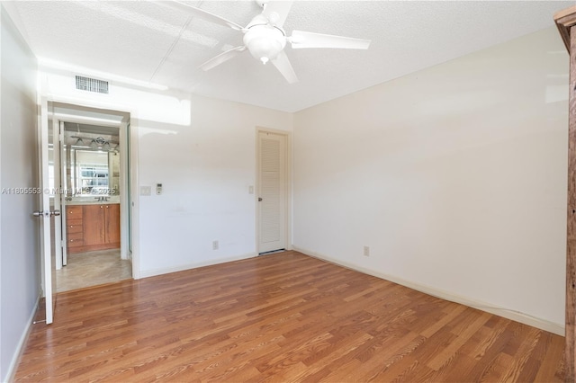 446 Flanders J 4460, Delray Beach, FL 33484 - unfurnished bedroom featuring light wood-type flooring, a ceiling fan, and baseboards