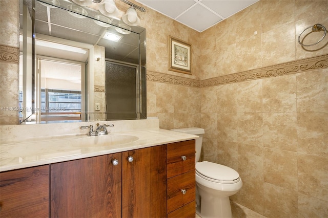 446 Flanders J 4460, Delray Beach, FL 33484 - bathroom featuring a stall shower, tile walls, toilet, and vanity