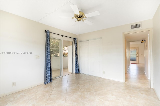 446 Flanders J 4460, Delray Beach, FL 33484 - spare room with a ceiling fan, light tile patterned floors, and baseboards