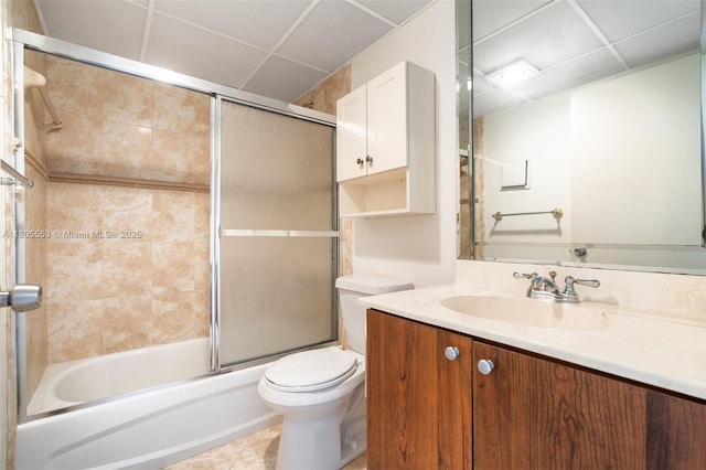 446 Flanders J 4460, Delray Beach, FL 33484 - full bath featuring toilet, a paneled ceiling, vanity, combined bath / shower with glass door, and tile patterned flooring