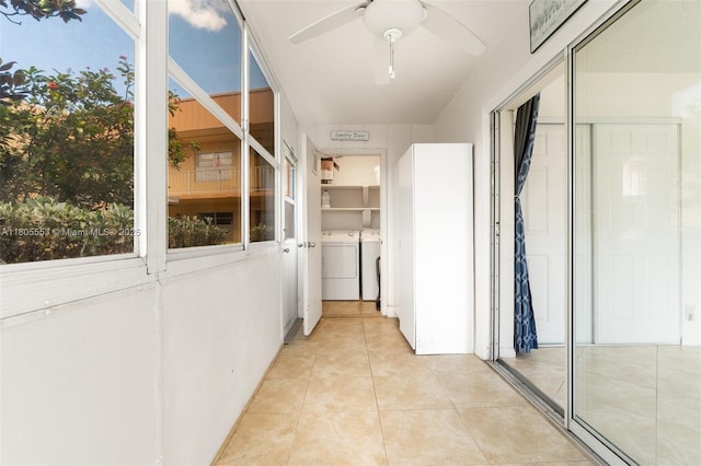 446 Flanders J 4460, Delray Beach, FL 33484 - hall with washer and clothes dryer and light tile patterned flooring