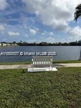 2200 N Park Ln Unit 311, Hollywood, FL 33021 - dock area with a water view and a yard