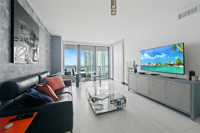 650 Ne 32 3302, Miami, FL 33137 - living area with expansive windows, light tile patterned floors, and an accent wall