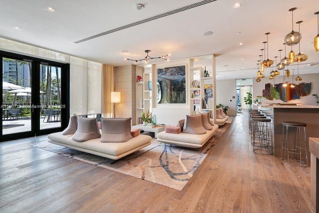 650 Ne 32 3302, Miami, FL 33137 - living area with a chandelier, wood finished floors, and french doors