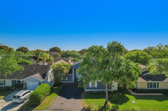 14823 SW 139th Ct, Miami, FL 33186 - view of front facade with a front yard