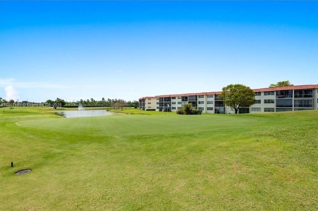 9220 S Hollybrook Lake Dr Unit 208, Pembroke Pines, FL 33025 - view of property's community featuring a water view, view of golf course, and a yard